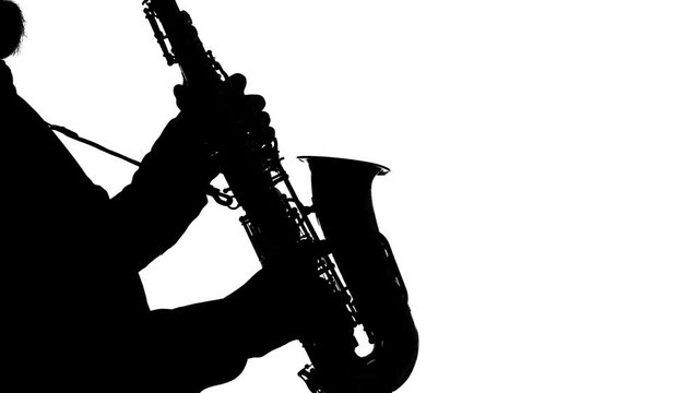 Recital of an actor playing the saxophone, isolated, silhouette, solo