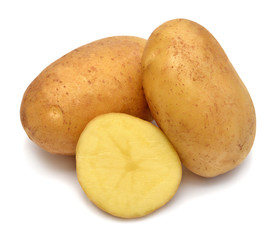 Young potato and slice isolated on white background. Harvest new. Flat lay, top view