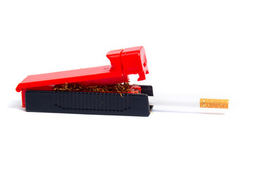 machine for driving tobacco into a sleeve with tobacco and sleeves on a white background. isolate