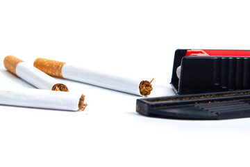 open tobacco driving machine and cigarettes on a white background. isolate