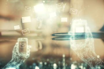 Double exposure of flying envelope hologram over coffee cup background in office. Concept of E-mail