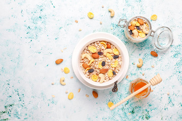 Healthy breakfast. Fresh granola, muesli with nuts and frozen berries. Top view. Copy space.