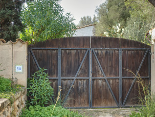 Closed steel and wooden gate.
