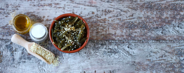 Fototapeta na wymiar Selective focus. Sea kale in a bowl. Healthy food. Vegan food. Sea kale with sesame seeds.