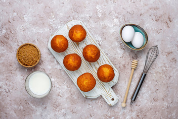 Cupcake baking background with kitchen utensils.