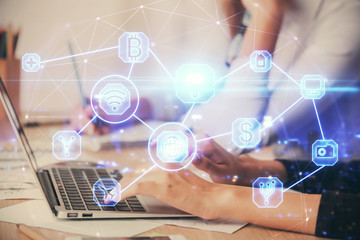 Double exposure of woman hands typing on computer and social network theme hologram drawing. People media concept.