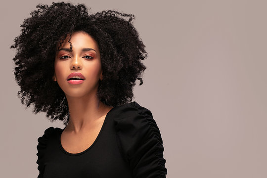 Beautiful afro woman posing in studio.