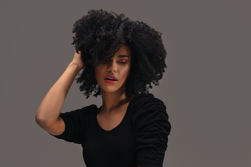 Beautiful afro woman posing in studio.