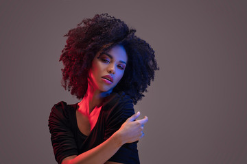 Beautiful afro woman posing in studio.