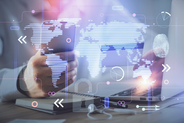 Double exposure of man hands holding a credit card and world map drawing. International Internet E-commerce and technology concept.