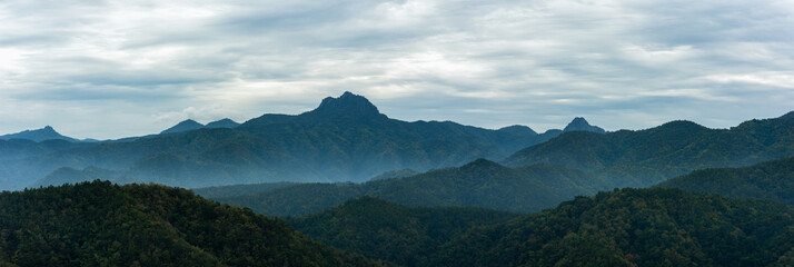 Fototapeta na wymiar Panoramic mountains in deep forest at Thailand.