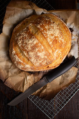 Delicious italian bread on wooden table. Rustic concept.