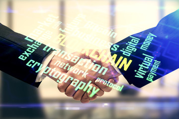 Double exposure of blockchain hologram and handshake of two men. Crypto business concept.