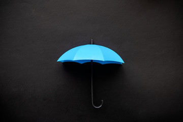 Blue umbrella 3D icon isolated on black background