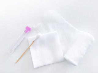 blood collected tube ,swab and gauze on roll gauze on white background in health check up concept