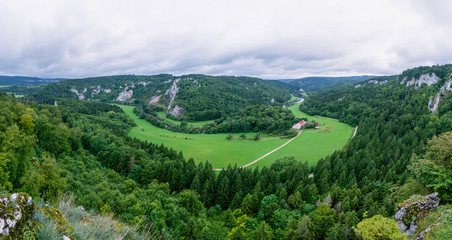 Aerial view of beautiful hills; green hills covered by forest and grass 