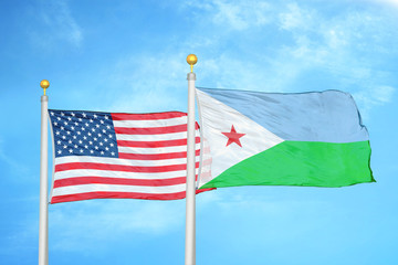 United States and Djibouti two flags on flagpoles and blue cloudy sky