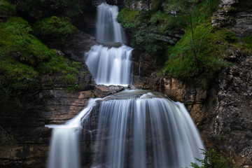 Fototapeta na wymiar Beautiful waterfalls flowing in the valley