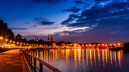 Beautiful night view of Moselle in Koblenz of Germany; brilliant lake and buildings
