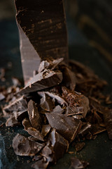 Chunks of dark chocolate with dark background