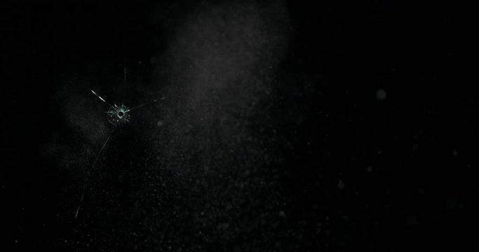 Broken cracks glass fracture effect texture isolated abstract black background. Bullet cracked window with big hole screen mirror weapon shot.