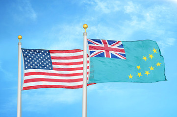 United States and Tuvalu two flags on flagpoles and blue cloudy sky