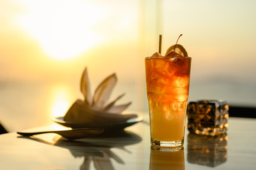 Glass of cocktail a shadow on the sky bar counter in restaurant. Cocktail is perfect for a summer break. Cocktail, beverage, alcohol, relax, restaurant, summer concept.