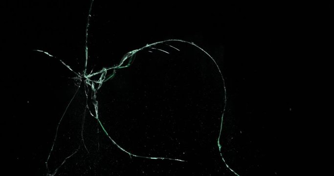 Broken cracks glass fracture effect texture isolated abstract black background. Bullet cracked window with big hole screen mirror weapon shot.