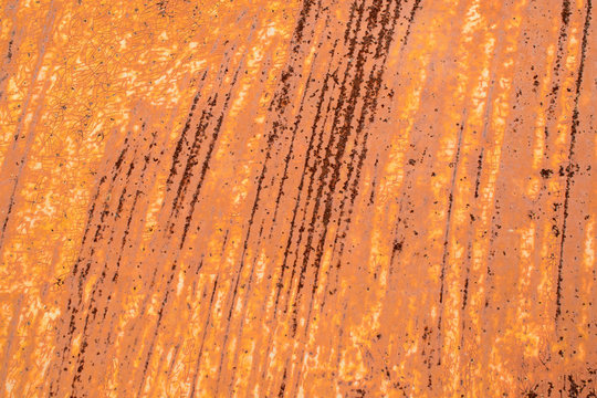 Metal Sheet With Old Cracked Paint. Streaks Of Strong Rust. Primary Colors - Peru Tan, Porsche, Almond.