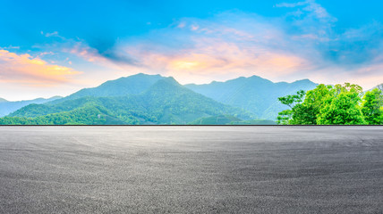 Race track road and green mountain nature landscape at sunset,panoramic view.