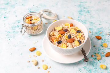 Healthy breakfast. Fresh granola, muesli with nuts and frozen berries. Top view. Copy space.