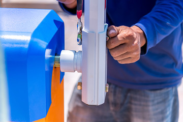 Close up technician check key lock barrier gate automatic system for control entrance way security area.
