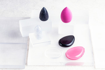 Beauty routine. Makeup palettes with blushes and powder. Minimalist beauty flat lay. Beauty palettes with mirrors. Make up products in minimalist palettes. Pastel blush and powder. Beige, pink colors.