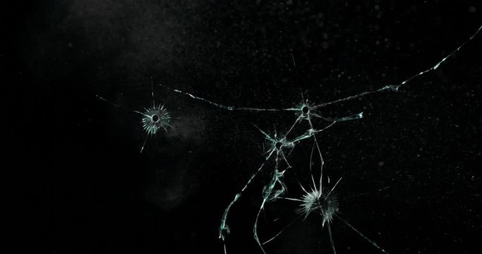 Broken cracks glass fracture effect texture isolated abstract black background. Bullet cracked window with big hole screen mirror weapon shot.