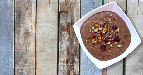 Raw vegan vegetarian food. Flax porridge with walnuts and strawberries for Breakfast. Healthy eating lifestyle