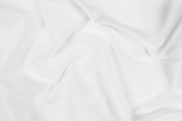 Obraz premium Abstract white fabric texture background. Cloth soft wave. Creases of satin, silk, and cotton. 