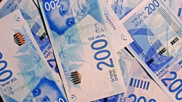 200 NIS Israeli shekel notes rotating in frame 4k studio shot