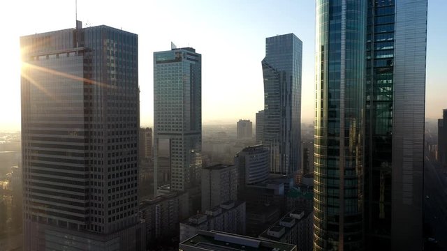 The beautiful sight of the skyscrapers in Warsaw, Poland during sunset - aerial