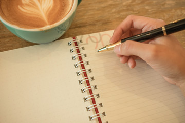 defocus hand of women working with coffee in the morning in work from home concept