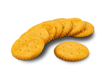 Crunchy round crackers lay on the floor on white background with clipping path.