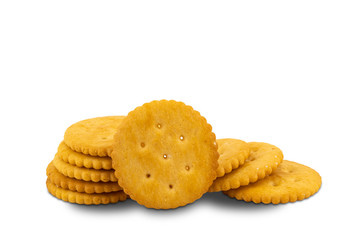 Pile of freshly baked crunchy round crackers on white background with clipping path