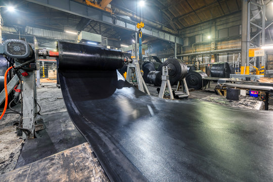 Interior of a factory for manufacturing rubber conveyor belts.