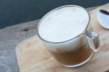 Coffee cup placed on wooden table.