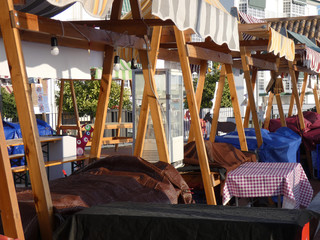 View of empty market stalls in early Andalusian winter sunshine