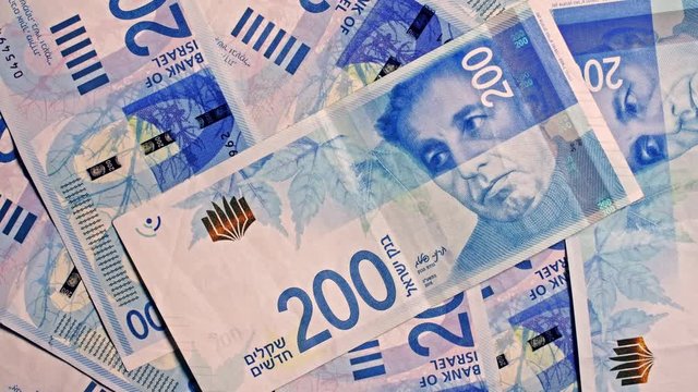 200 NIS Israeli shekel notes rotating in frame 4k studio shot