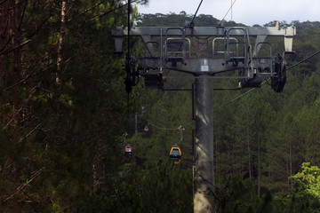 cable car taking tourist in Da Lat (Dalat) city, vietnam lake
