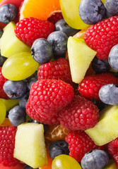 Fresh fruit salad as background, healthy nutrition concept