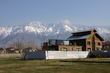 Large house in residential neighborhood of Srinagar, Kashmir looking towards the Himalayas