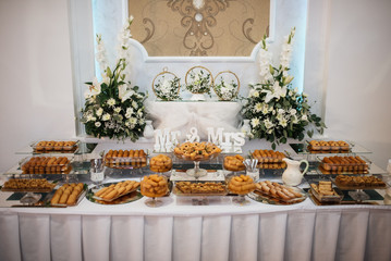 Fototapeta na wymiar A sweet table with biscuits and candy for a party