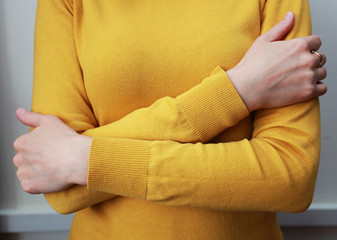 woman hugs herself with hands
